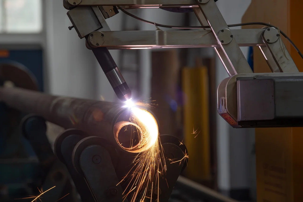 Robotic plasma cutter in action on a metal pipe